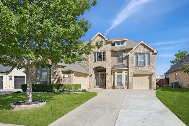 8 Center Ct, Heath, TX 75032 - traditional home featuring stone siding, concrete driveway, and a standing seam roof