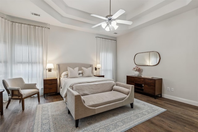 8 Center Ct, Heath, TX 75032 - bedroom featuring a tray ceiling, dark wood finished floors, and ceiling fan