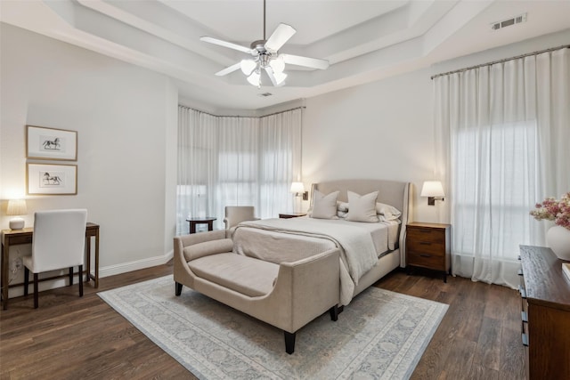 8 Center Ct, Heath, TX 75032 - bedroom with a raised ceiling, dark wood-type flooring, and a ceiling fan