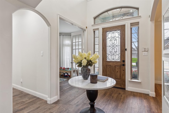 8 Center Ct, Heath, TX 75032 - foyer featuring wood finished floors and arched walkways