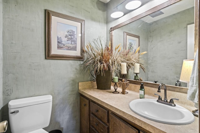 half bath with vanity and toilet