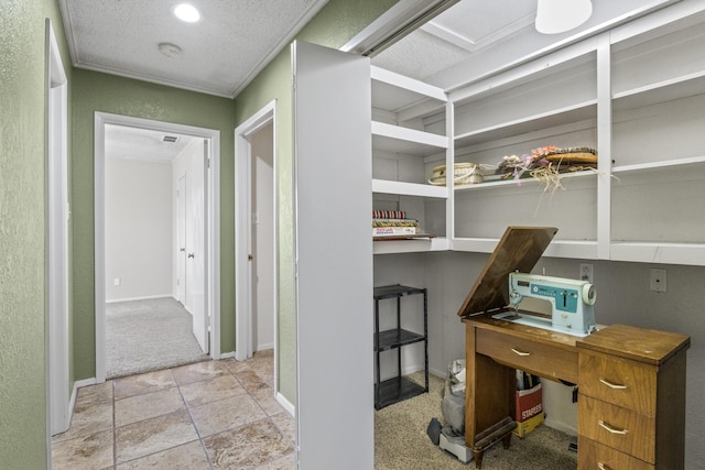 interior space with a textured ceiling and baseboards