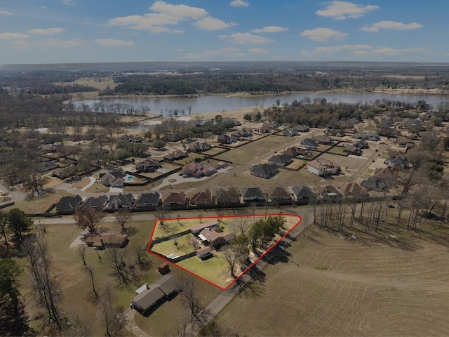 bird's eye view with a water view and a residential view