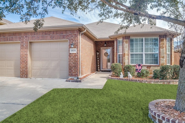 single story home with brick siding, roof with shingles, concrete driveway, an attached garage, and a front yard