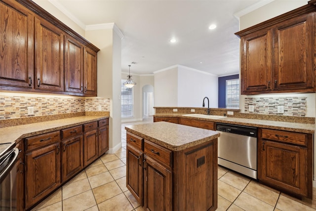 kitchen featuring a center island, light countertops, stainless steel dishwasher, a sink, and light tile patterned flooring