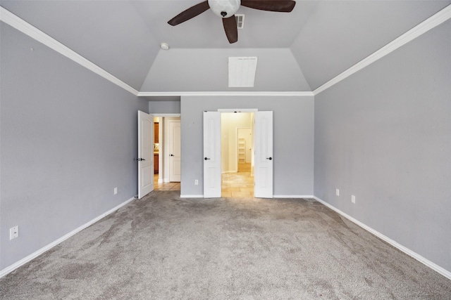 unfurnished bedroom featuring carpet floors, lofted ceiling, visible vents, ensuite bath, and baseboards