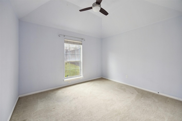 empty room featuring carpet floors, ceiling fan, baseboards, and lofted ceiling