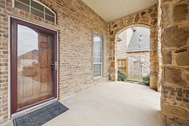 doorway to property featuring covered porch