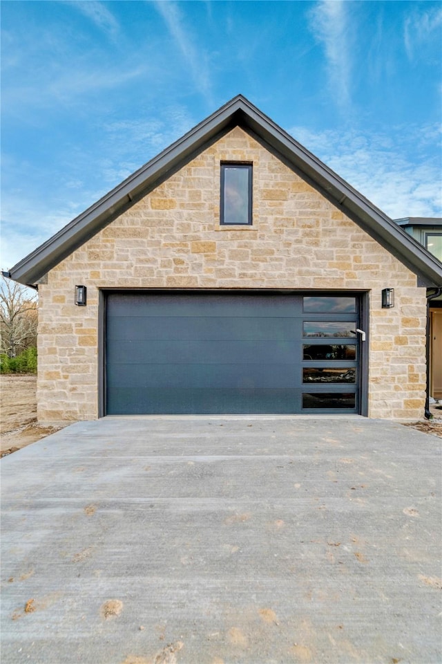 garage featuring driveway