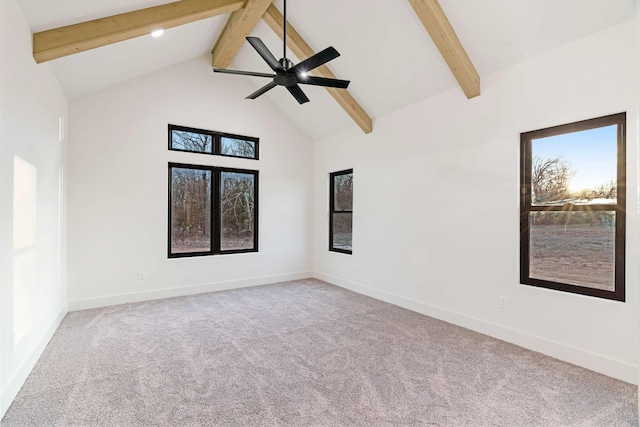 carpeted empty room with high vaulted ceiling, a ceiling fan, beam ceiling, and baseboards