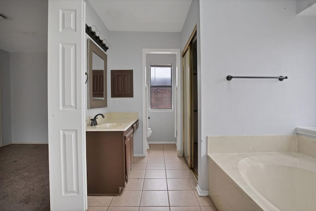 bathroom featuring a garden tub, toilet, tile patterned flooring, visible vents, and vanity