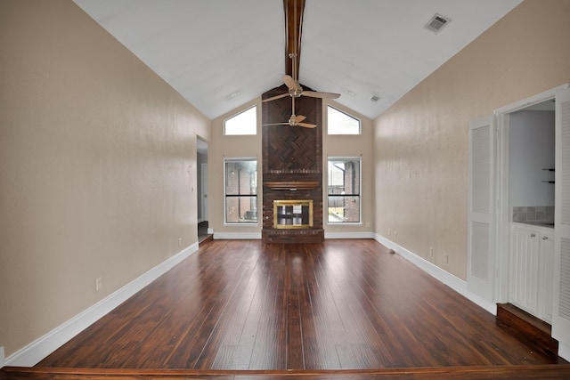 unfurnished living room with dark wood-style flooring, visible vents, a brick fireplace, ceiling fan, and high vaulted ceiling