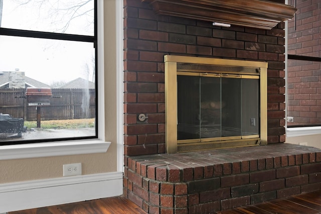 room details with a fireplace and wood finished floors