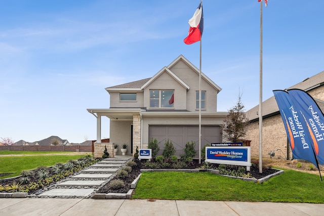 view of front of house featuring a front lawn, brick siding, fence, and an attached garage