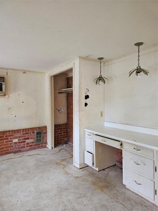 interior space with concrete floors and a textured ceiling