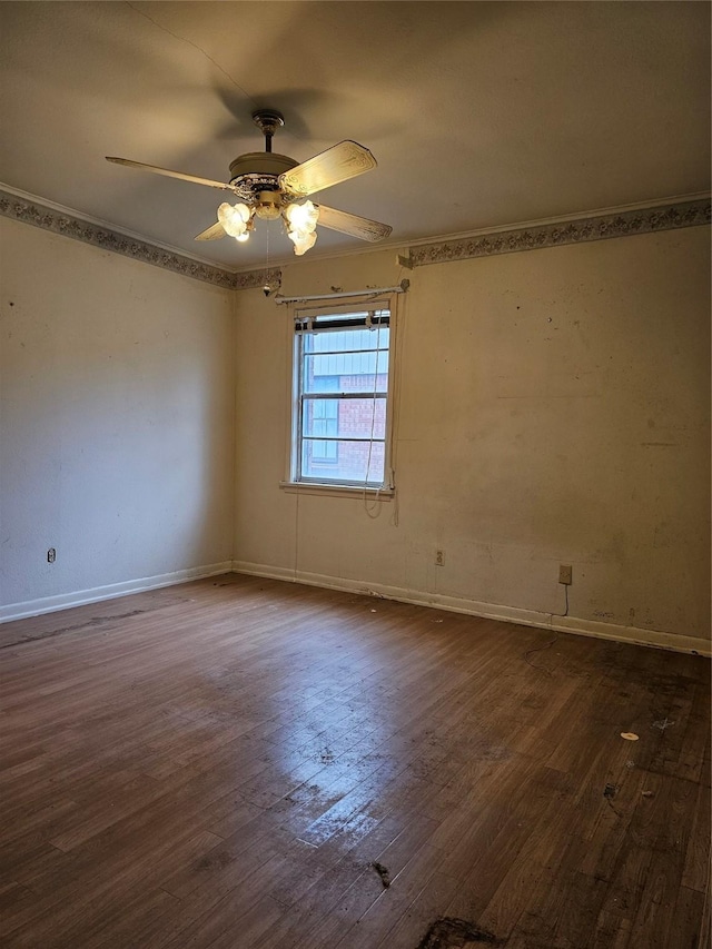 unfurnished room with ceiling fan, baseboards, and dark wood-style flooring