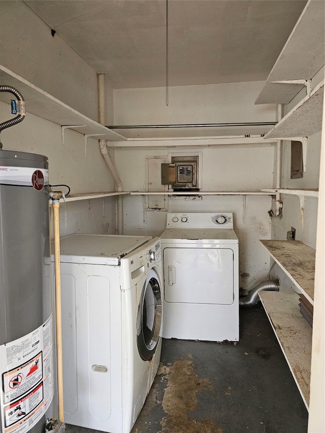 laundry area with gas water heater, separate washer and dryer, and laundry area