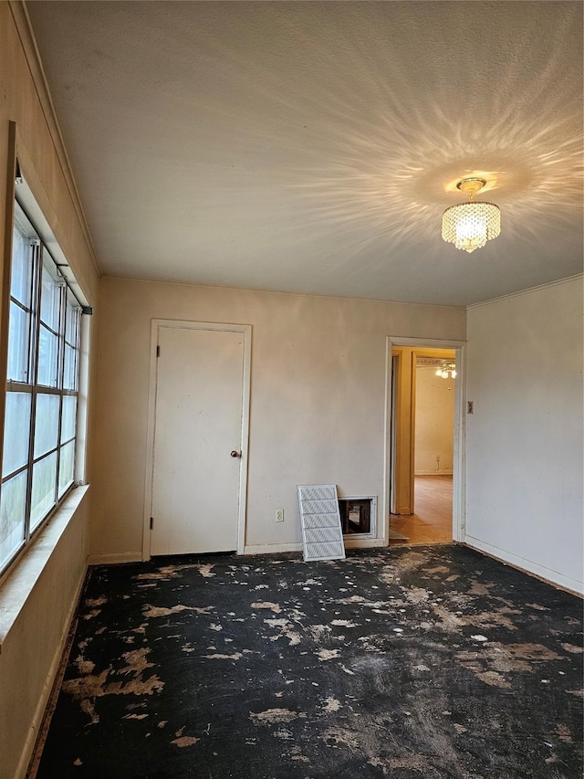 empty room with dark colored carpet