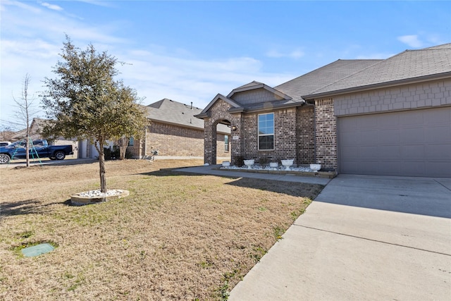 view of front of home featuring brick siding, concrete driveway, roof with shingles, an attached garage, and a front yard