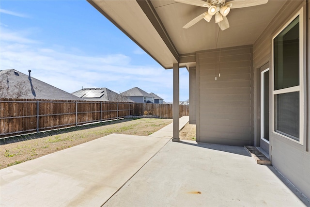 view of patio with a ceiling fan and a fenced backyard