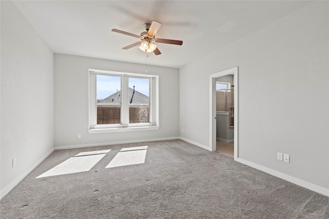 unfurnished room featuring light carpet, ceiling fan, and baseboards