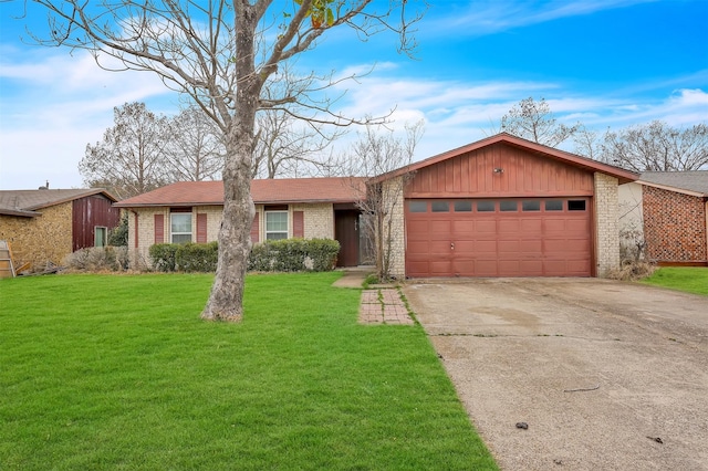 view of front of home with a garage, driveway, brick siding, and a front lawn