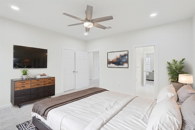 bedroom featuring a ceiling fan, recessed lighting, light colored carpet, and baseboards