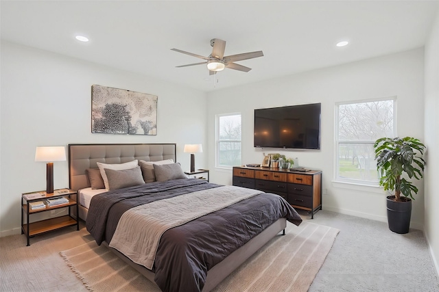 bedroom with light carpet, baseboards, a ceiling fan, and recessed lighting