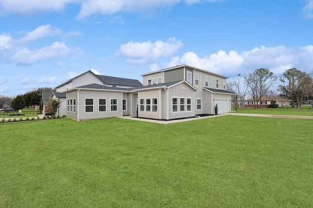 rear view of property featuring board and batten siding, concrete driveway, a lawn, and an attached garage