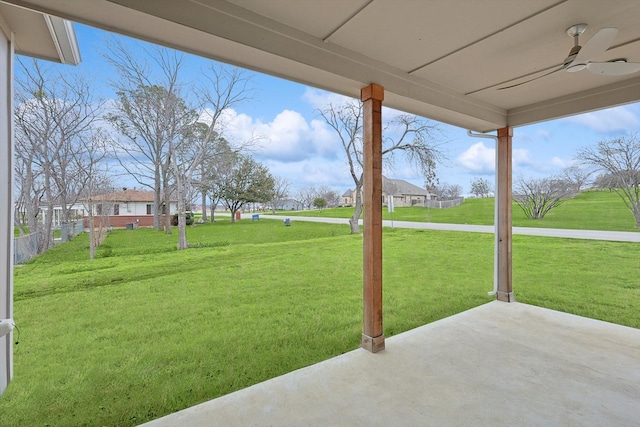 view of yard with a patio and a ceiling fan