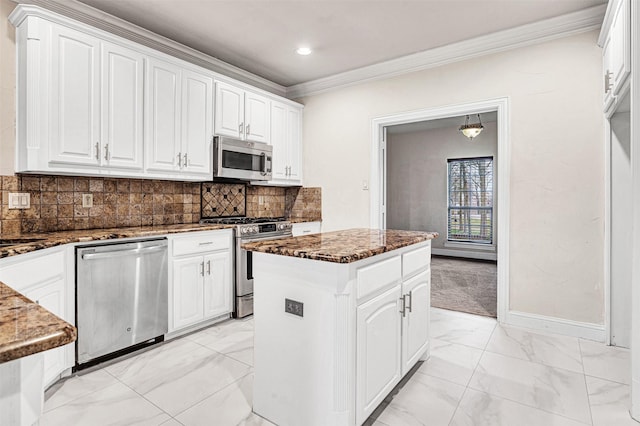 kitchen with stainless steel appliances, a center island, marble finish floor, and white cabinetry