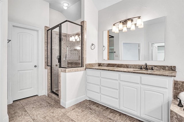 bathroom featuring a stall shower, tile patterned floors, a bathtub, and vanity