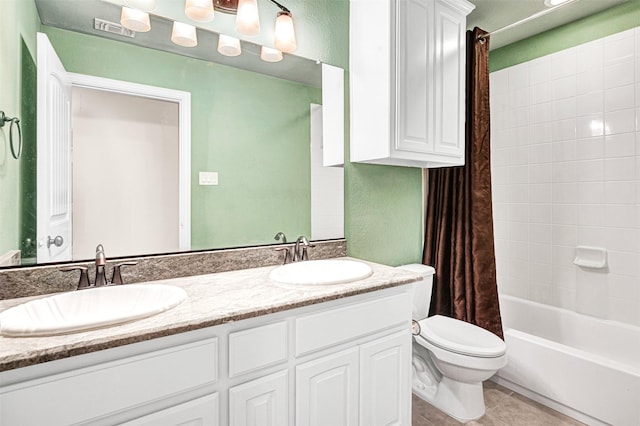 full bathroom with tile patterned flooring, visible vents, a sink, and toilet