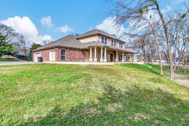 view of front of house with a porch, brick siding, an attached garage, and a front lawn