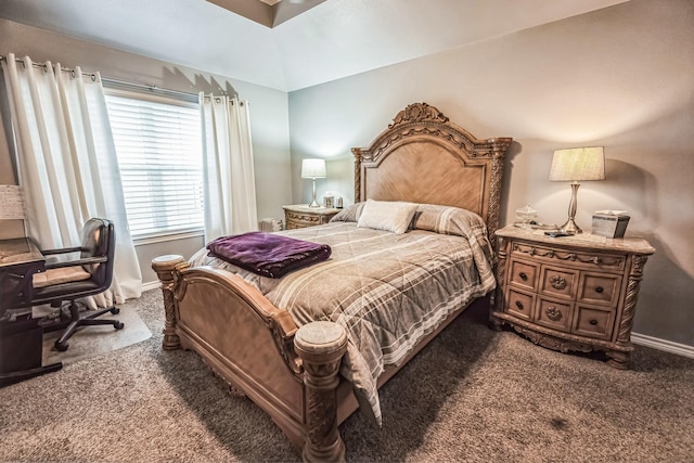 carpeted bedroom featuring baseboards