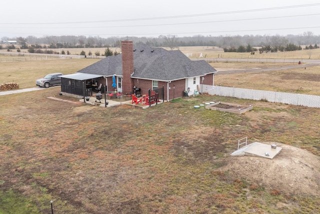 birds eye view of property featuring a rural view