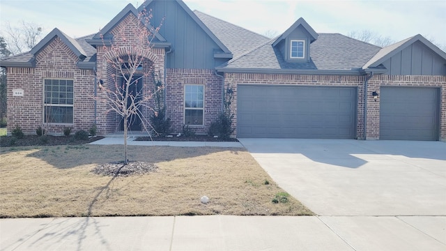 view of front of house featuring brick siding, a shingled roof, concrete driveway, board and batten siding, and a garage