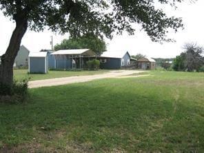 view of yard with a storage unit