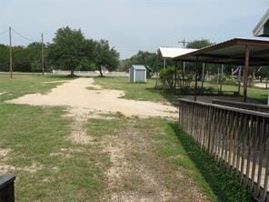 view of yard with a shed and an outbuilding