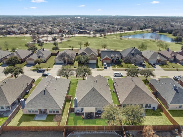 bird's eye view featuring a water view and a residential view