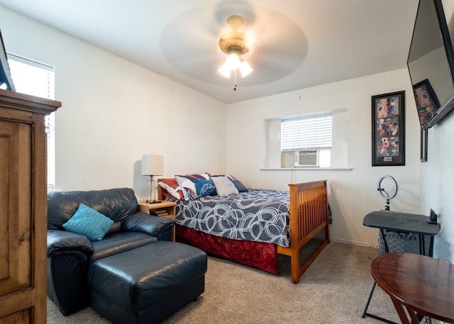 bedroom featuring light carpet, cooling unit, and a ceiling fan