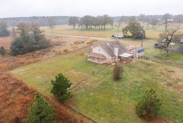 birds eye view of property featuring a rural view