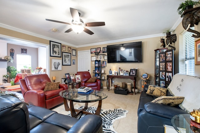 living room featuring ornamental molding, a ceiling fan, and light tile patterned floors