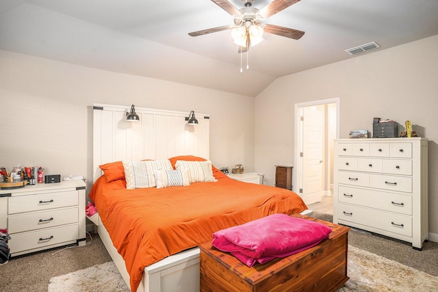 bedroom with vaulted ceiling, a ceiling fan, visible vents, and light colored carpet