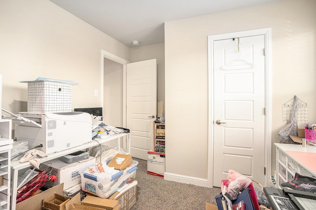 carpeted office with baseboards