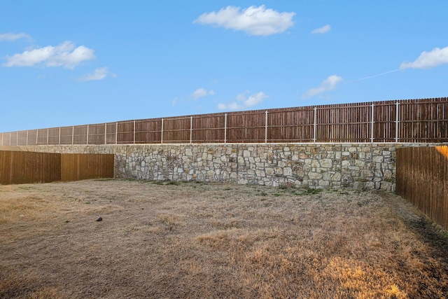 exterior space featuring a fenced backyard