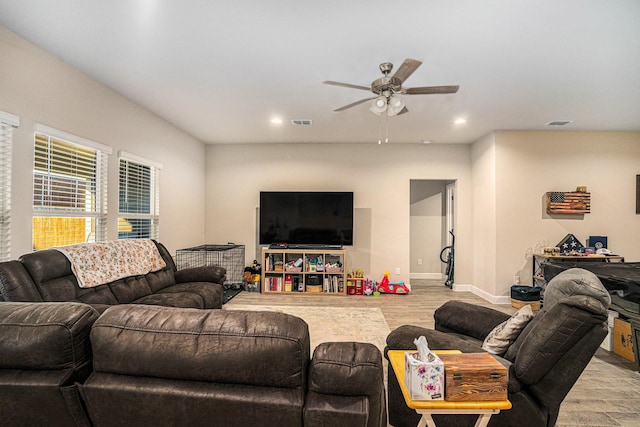 living room featuring recessed lighting, visible vents, ceiling fan, and light wood-style flooring