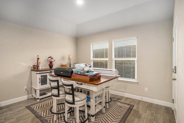 home office with dark wood-style floors, lofted ceiling, and baseboards