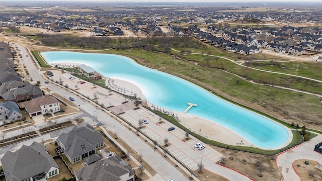 birds eye view of property featuring a residential view and a water view