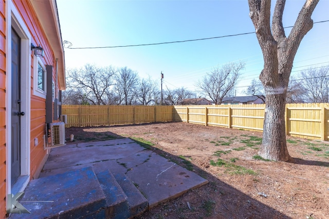 view of yard with a patio and a fenced backyard